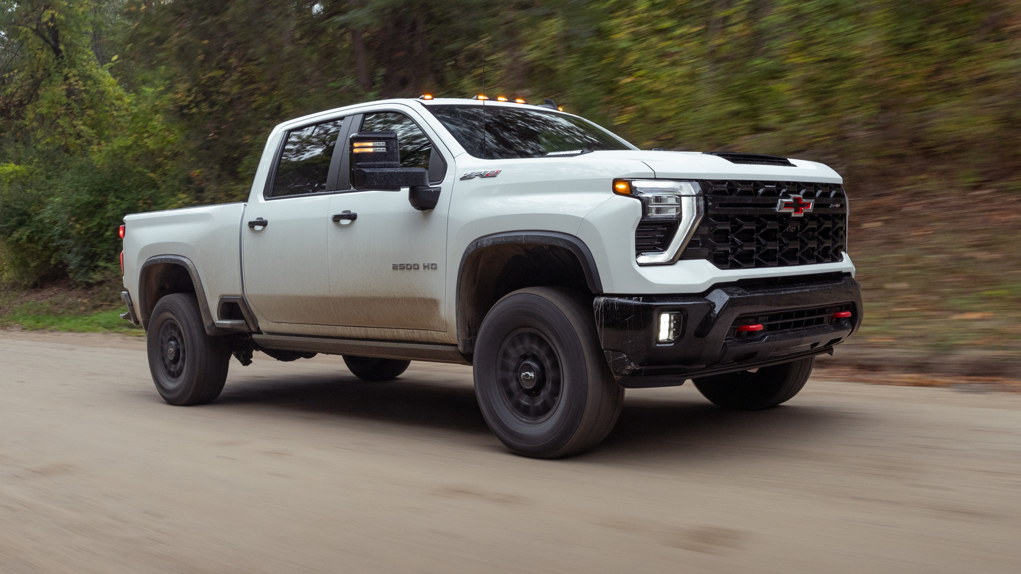 Experience the Chevrolet Silverado 2500 HD ZR2 in action, seamlessly blending its rugged workhorse capabilities with an undeniable flair for adventure. From tackling tough tasks with ease to conquering off-road terrains, this truck is built to work hard and play even harder