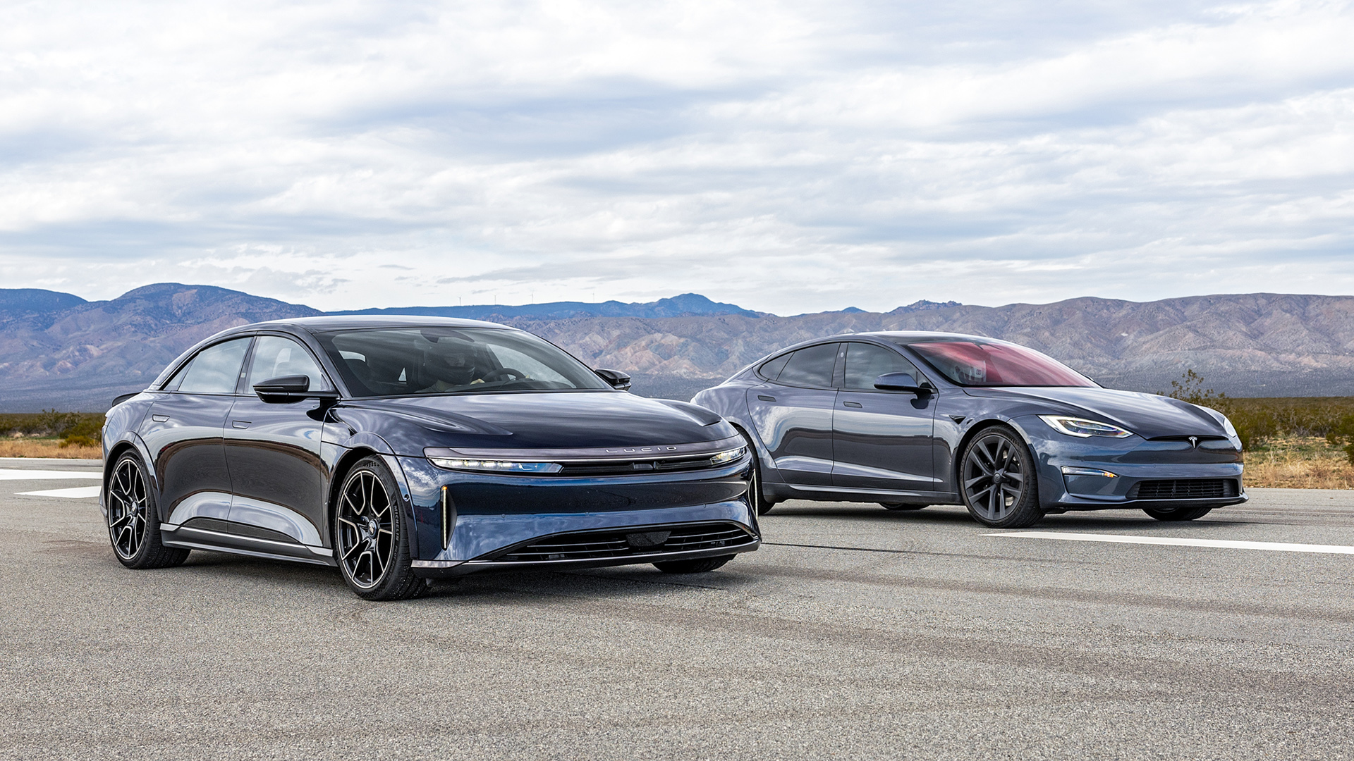 While you may have seen the Model S Plaid and Air Sapphire drag racing before, we guarantee you haven’t seen these two supersedans—all 2284 horses' worth—through a full half-mile. We also performed full instrumented testing on both cars, measuring their 0–60, 0–100, 1/4 mile, and 1/2 mile times. We also took the Tesla and the Lucid to the streets to find out if either of these electron-powered rockets are any good to drive.
