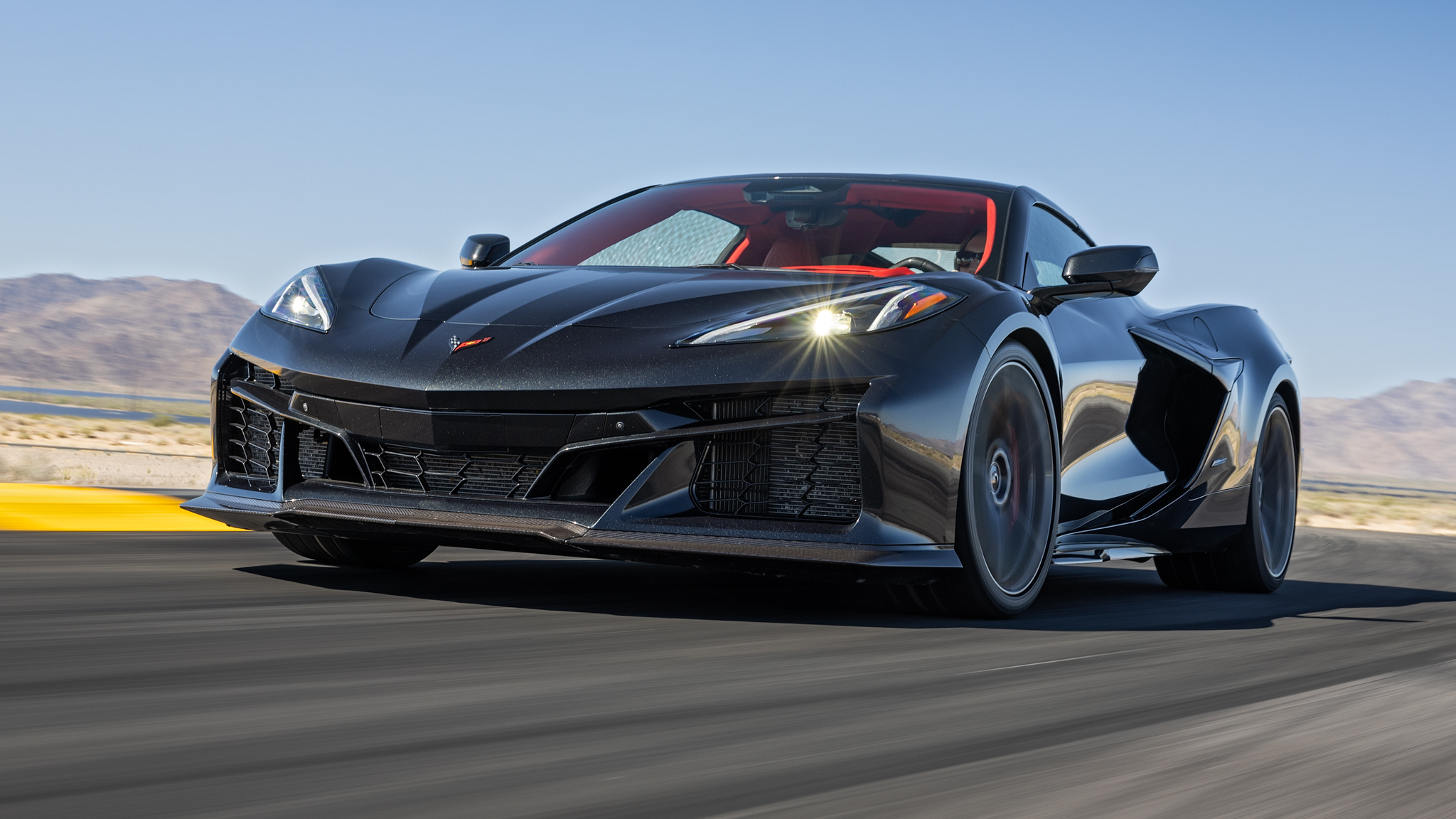 The 2024 Corvette E-Ray's headline feature is an all-new hybrid powertrain combining the Stingray’s 6.2-liter V-8 and a permanent-magnet electric motor mounted at the front axle (with a 1.9-kWh battery feeding it juice) to produce 655 horsepower and 592 lb-ft of torque